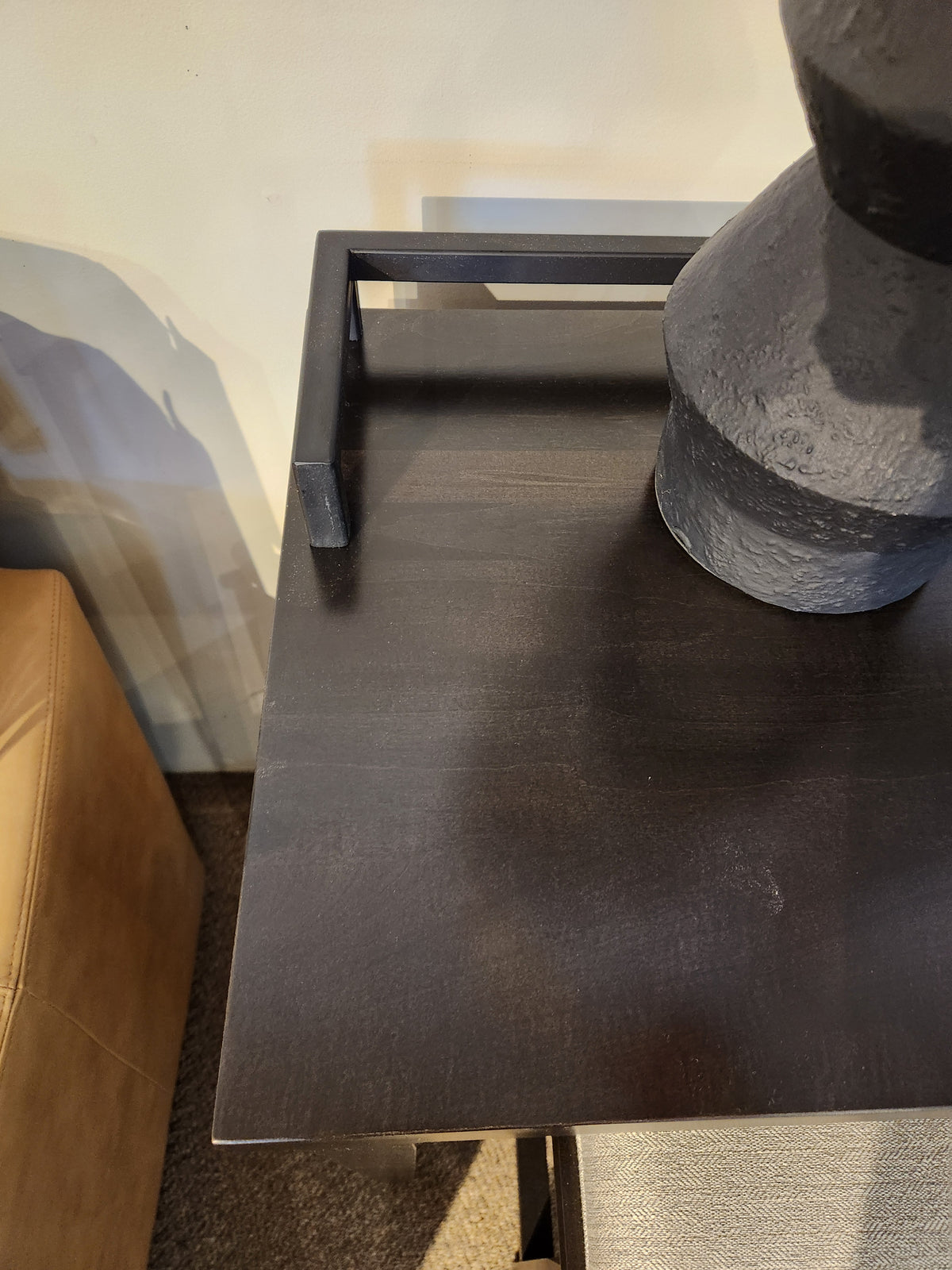 The Durham 905 Console Table features a metal rail, stools, and a dark wood finish—perfect for modern interiors.