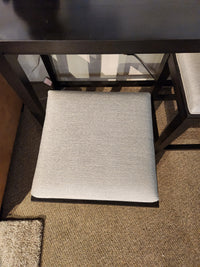 A Durham 905 console table with metal rail and stools sits on a brown carpeted floor.