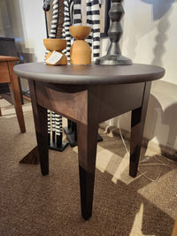 The Durham 905-24" Round Table in Java features three tapered legs; perfect for compact spaces and styling décor.