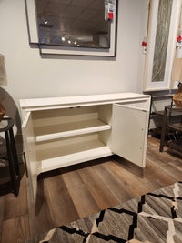 Jofran Gramercy 3 Door Accent Cabinet with one door open, wire-brushed texture, mirror shown above.