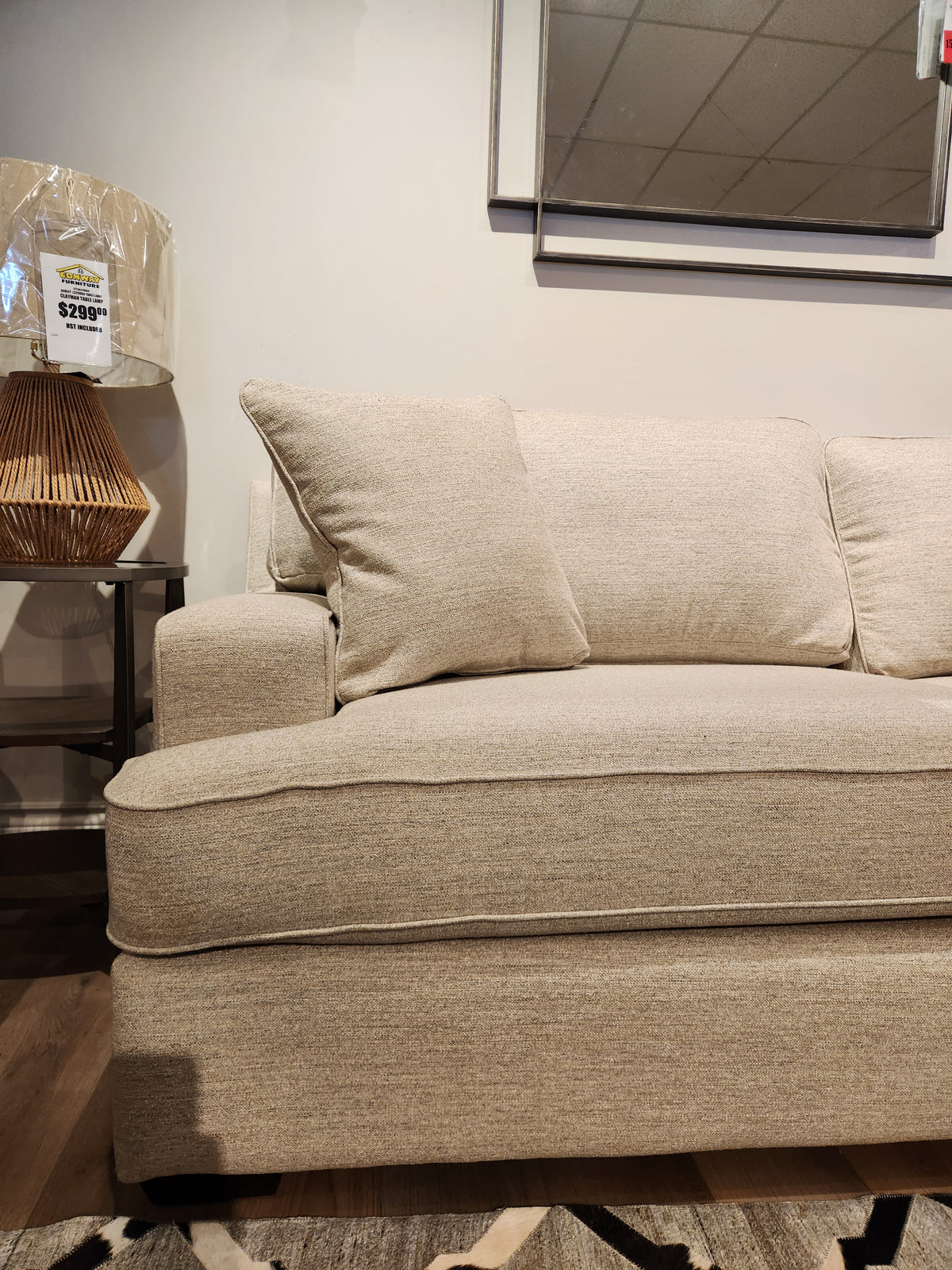 La-z-boy 663 Paxton Sofa with ComfortCore® cushions displayed beside a lamp and price tag in a showroom.