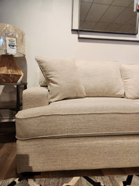 La-z-boy 663 Paxton Sofa with ComfortCore® cushions displayed beside a lamp and price tag in a showroom.
