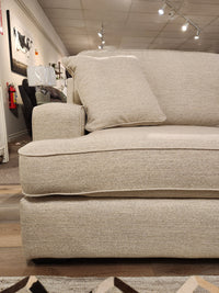 La-z-boy 663 Paxton Chair & 1/2 with ComfortCore cushion offers casual seating in a furniture showroom.