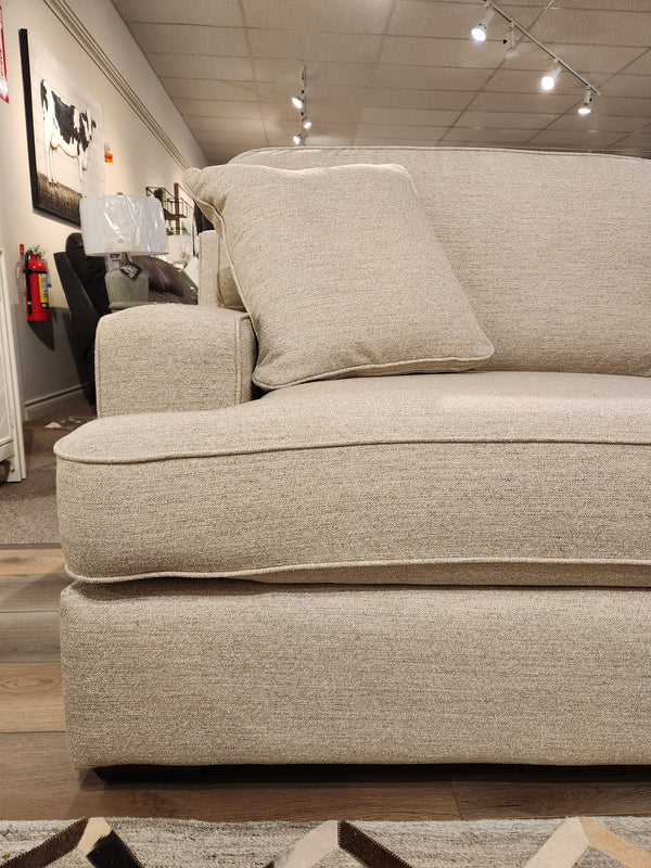 La-z-boy 663 Paxton Chair & 1/2 with ComfortCore cushion offers casual seating in a furniture showroom.