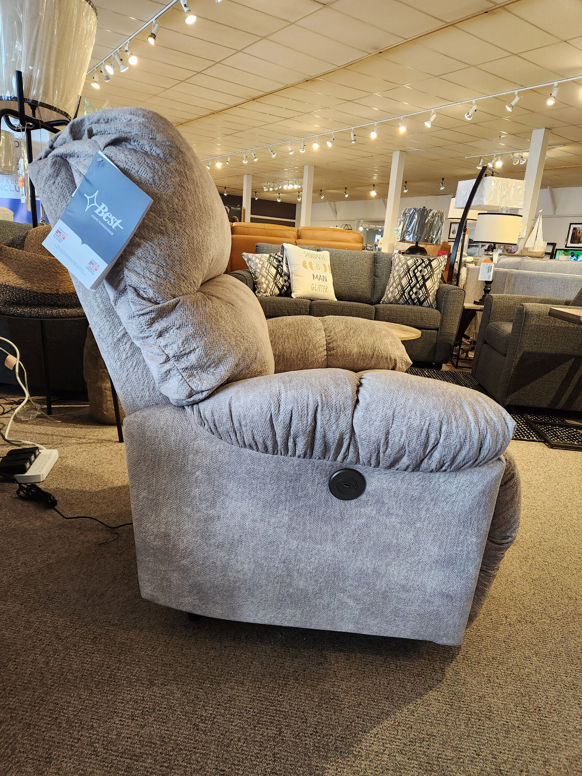 The Best 7MP84 Ellisport Power Space Saver Recliner features a side control button and is displayed in a showroom.