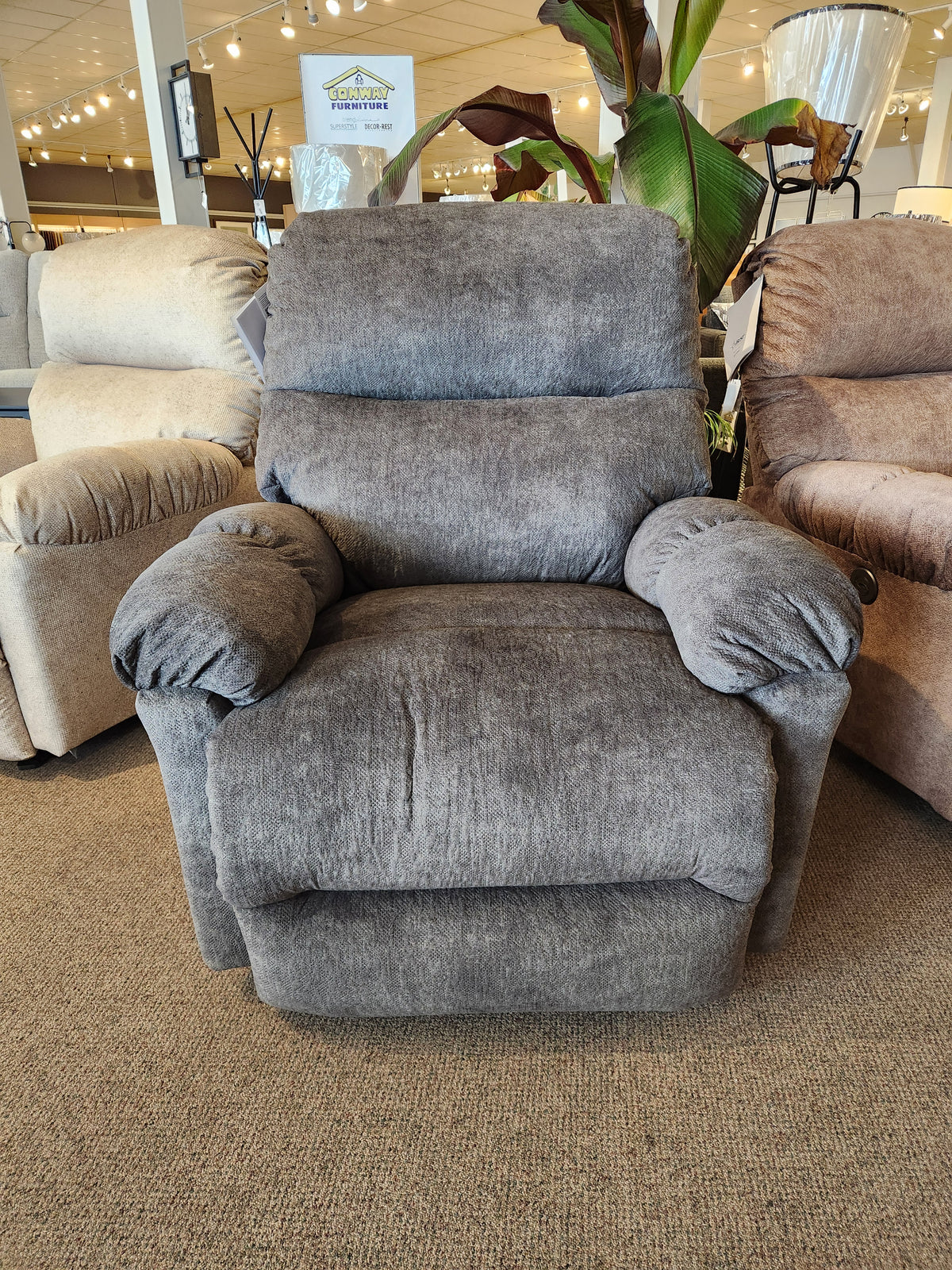 The Best 7MP84 Ellisport Power Space Saver Recliner is shown in gray among other recliners in a showroom.