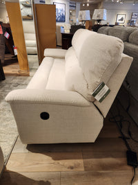 The La-z-boy 727 Brooks Reclining Sofa offers personalized comfort, showcased on a wooden floor in a furniture showroom.