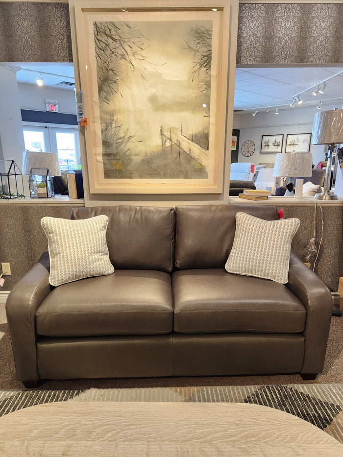 La-z-boy 638-620 Charlie apartment-size gray leather sofa with two pillows; modern decor, framed art above.