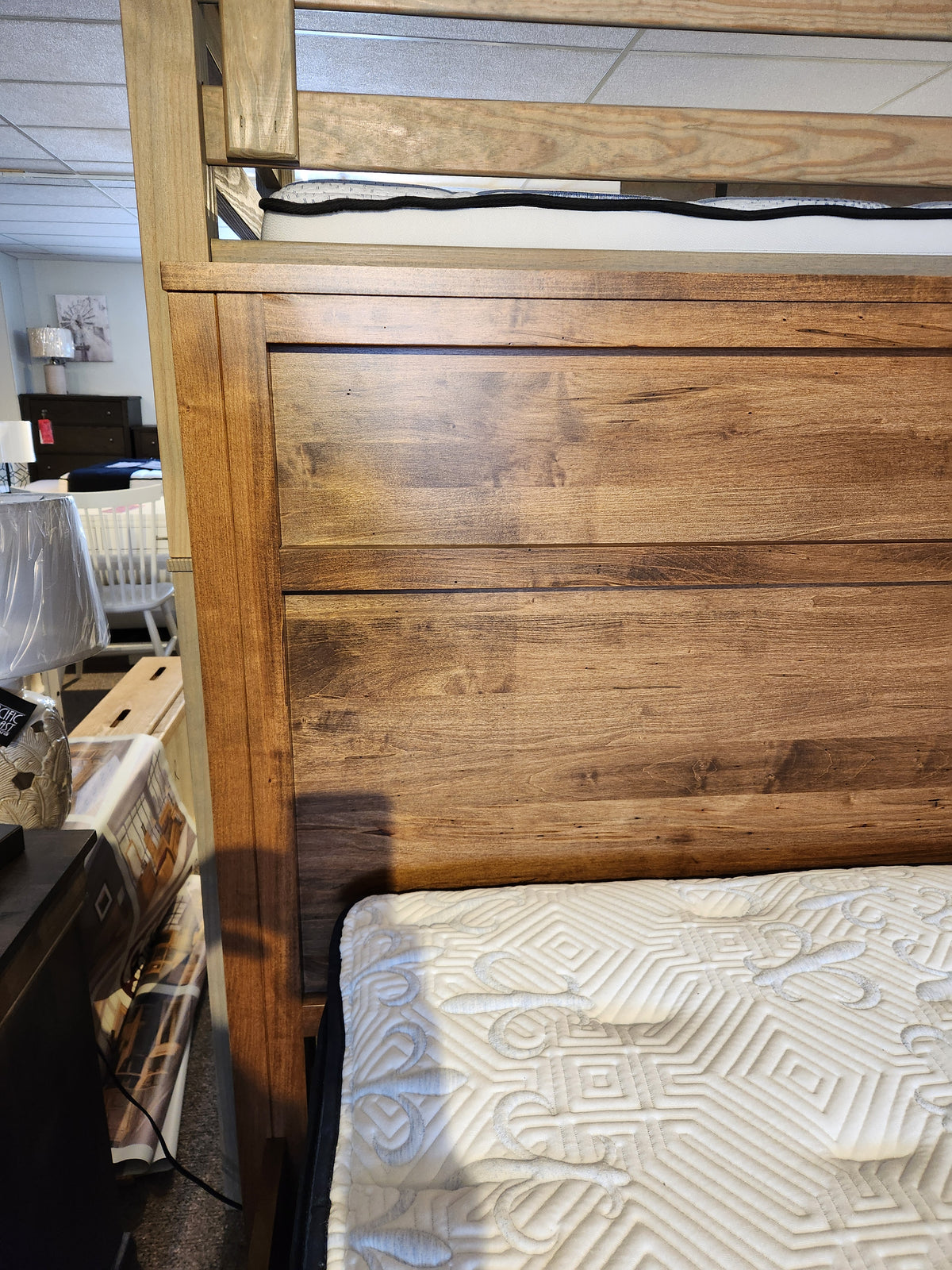Close-up of a Canadian showroom featuring the Vokes 247 Vokes Saugeen King Bed Frame.
