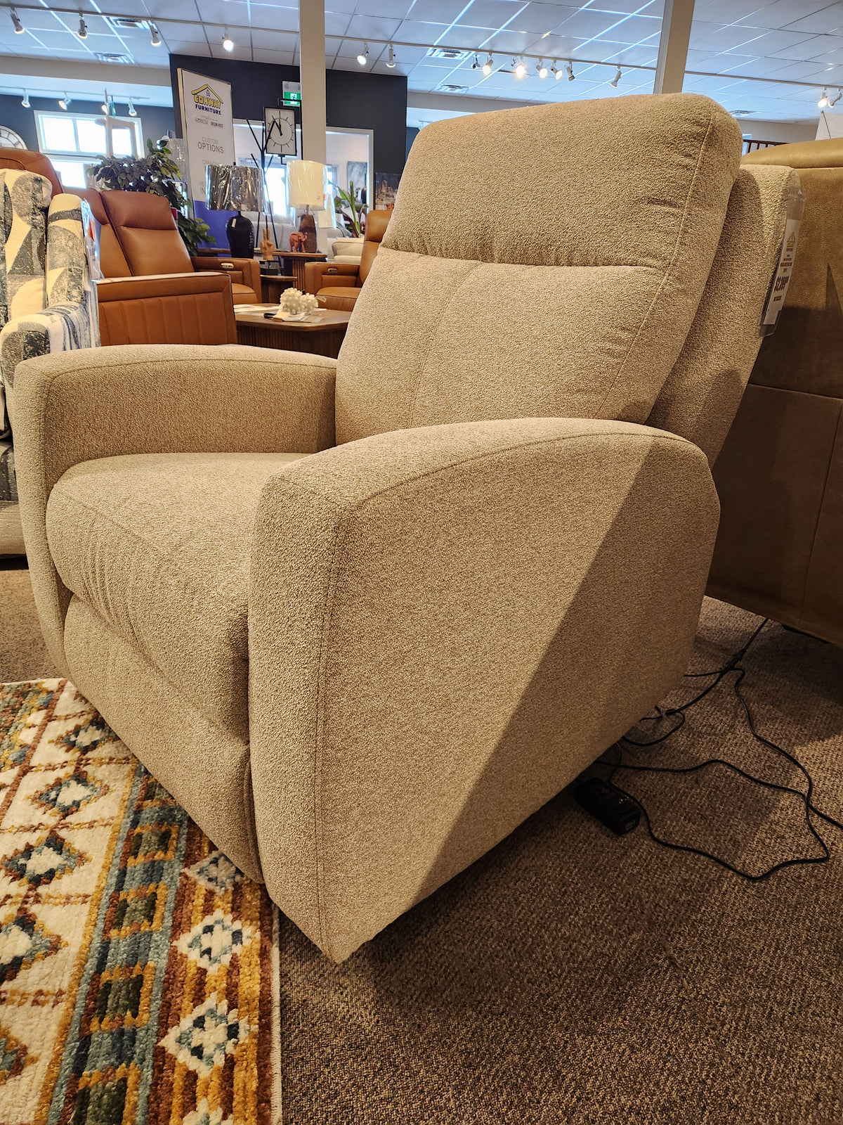 Aurora Furniture’s 88365 Muskoka Power Reclining Chair with Zero Gravity, shown on carpet beside a Muskoka Collection rug.
