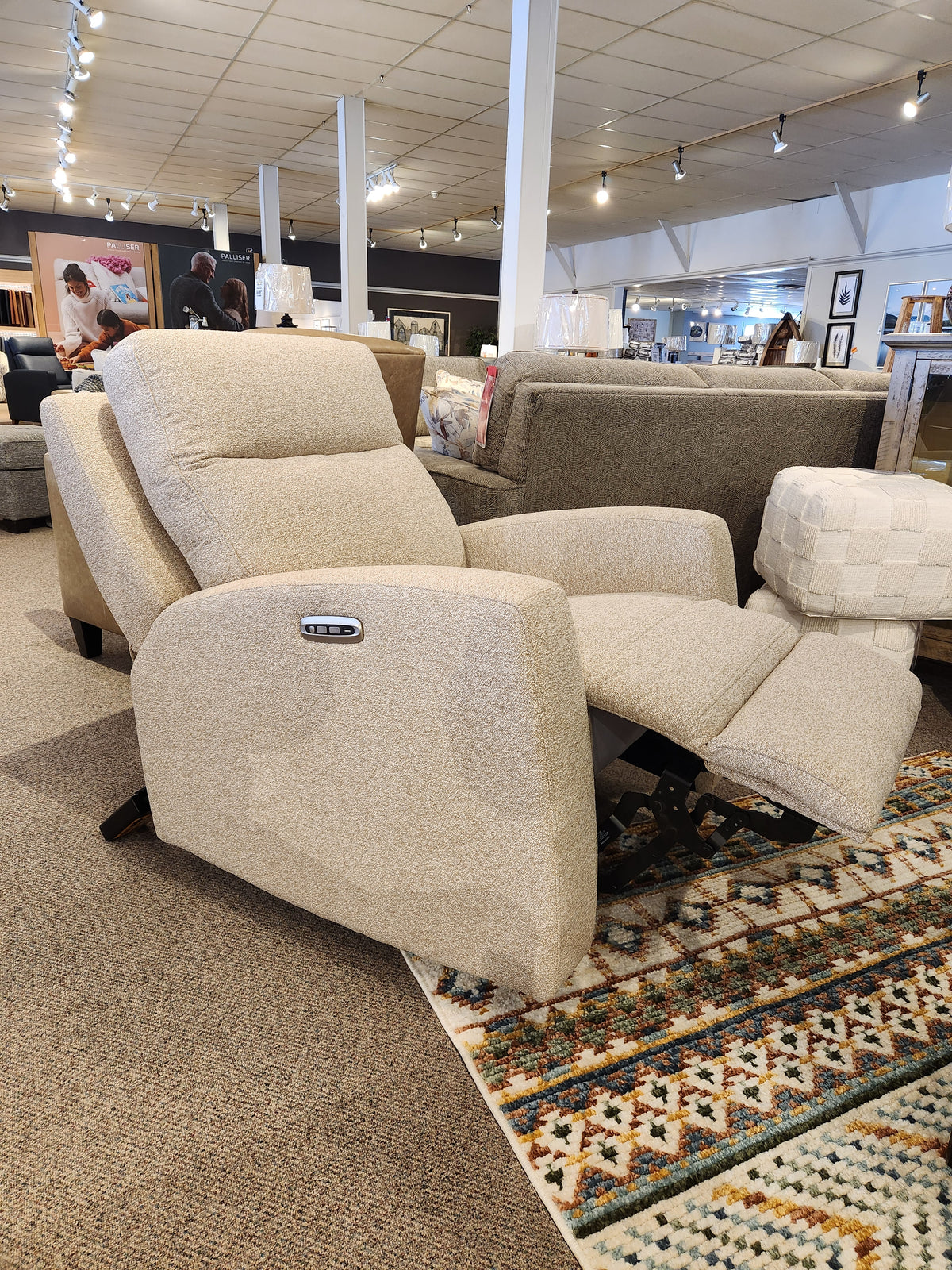 The Aurora Furniture 88365 Muskoka Power Reclining Chair in beige with Zero Gravity is featured among modern rustic displays.