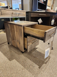The Handstone EL2D Electra Rolling File Cabinet with two open drawers is shown on wheels in a furniture showroom.