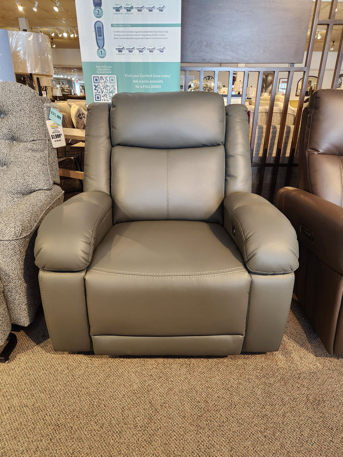 Golden Rec-P2 Ember Power Recliner in gray leather with dual USB ports, shown among other recliners on carpeted floor.