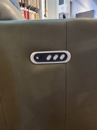 Close-up of control panel with three buttons and USB port on the Decor-rest M38505 Power Reclining Chair in green leather.