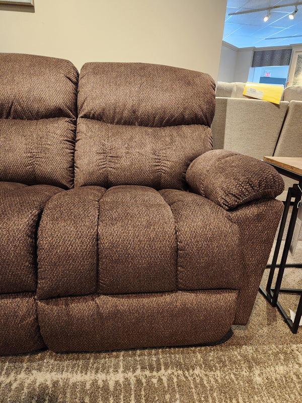 La-Z-Boy 766 Morrison Reclining Loveseat with plush cushions and wide arms, shown in a furniture showroom.