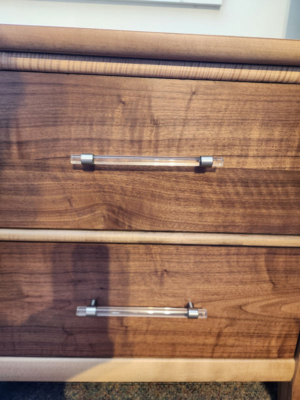 Vaughan Bassett 853 Nordhaven Two Tone Nightstand has walnut veneers, solid maple, and sleek clear and silver handles.