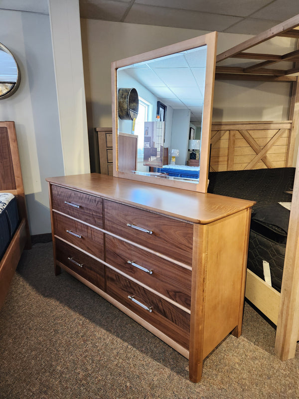 Vaughan Bassett 853-Two Tone 6-Drawer Dresser with Mirror displayed in a furniture showroom.
