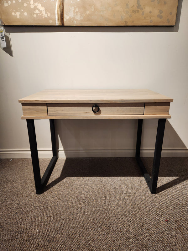 The Handstone CU2440-Cumberland Writing Desk features a center drawer and black legs—ideal for stylish home offices.