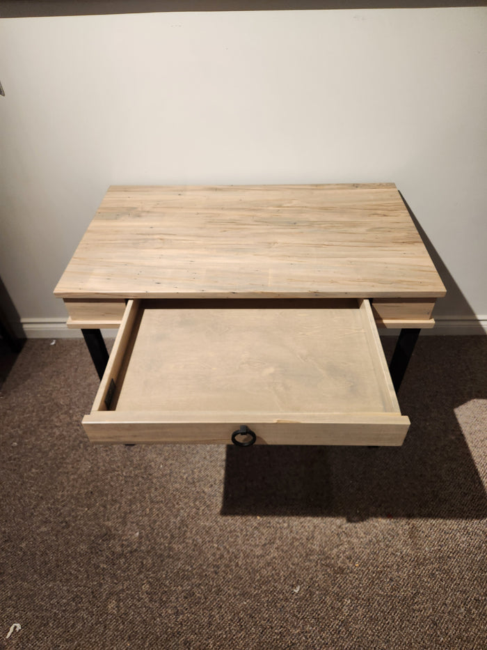 The Handstone CU2440-Cumberland Writing Desk, with a drawer, stands on brown carpet against a white wall.