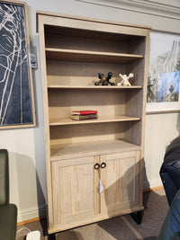 The Handstone CU80D-Cumberland Bookcase features vertical storage, 3 shelves, and 2 lower cabinet doors.