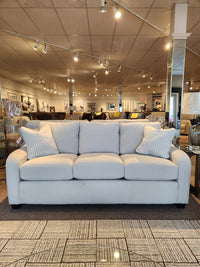 The La-z-boy 638-610 Charlie Sofa features four seat cushions and detached back pillows, on display in our showroom.