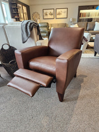 La-z-boy 431 Scarlett High-Leg Recliner in brown leather, shown with footrest extended in a living room showroom.