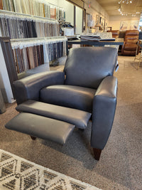 The La-Z-Boy 431 Scarlett dark gray leather high-leg recliner, made in the USA, is on display in the showroom.