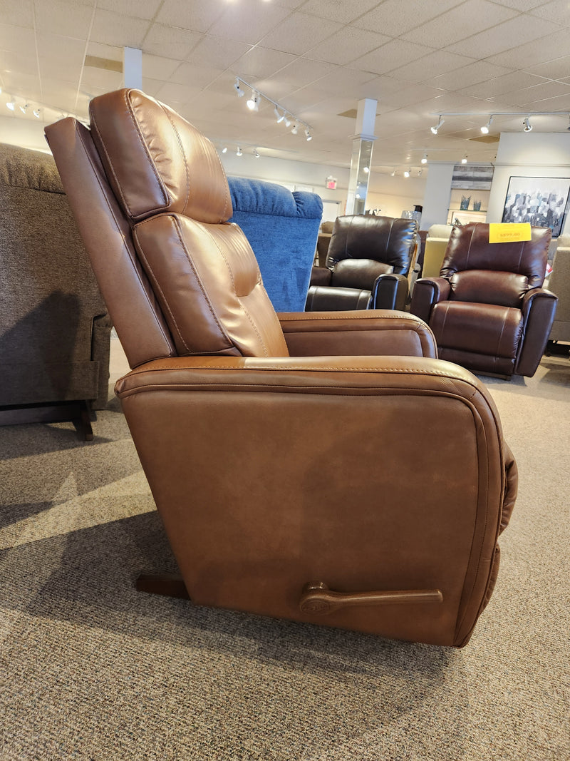 Side view of La-Z-Boy 807 Baron Rocker Recliner, brown leather, high back, lumbar support & lever near base.