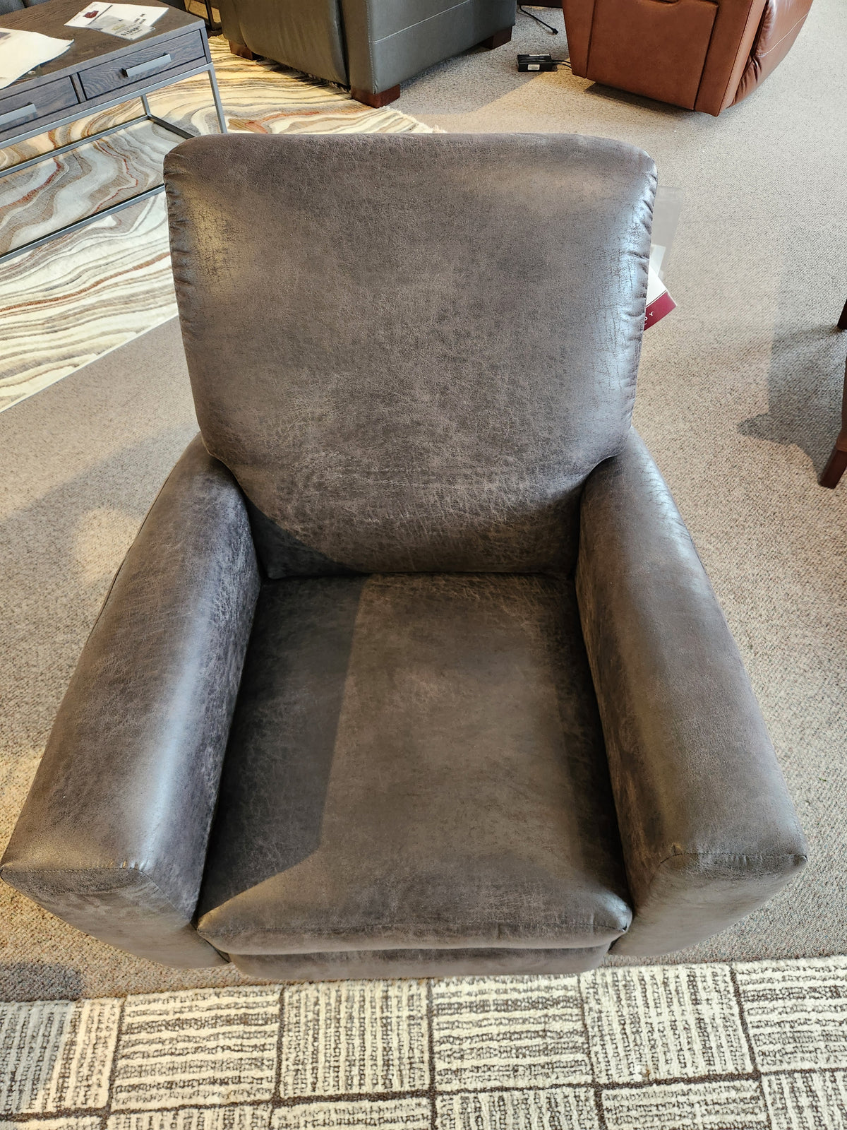 The La-z-boy 431 Scarlett High-Leg Recliner features padded armrests, a high back, and brown leather upholstery.