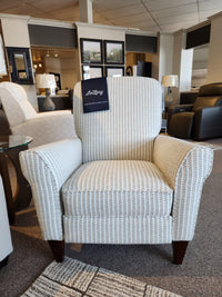 The La-Z-Boy 450 Haven High Leg Recliner, made in America, is displayed with a tag in the furniture showroom.