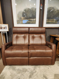 Palliser 42204 West Coast Power Reclining Loveseat with Headrest, shown with framed art in the background.
