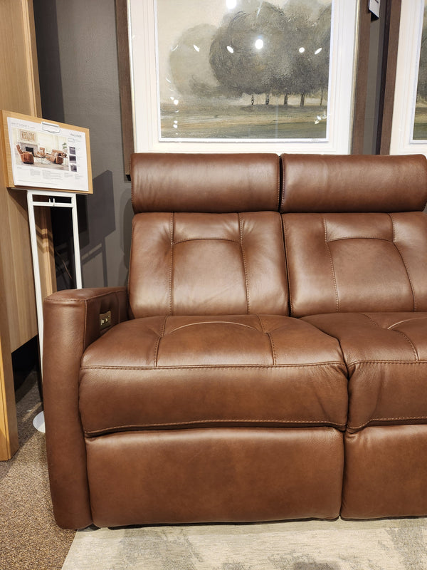 Palliser 42204 West Coast Power Reclining Loveseat with Headrest, shown in a showroom with art and display stand.
