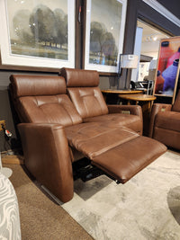 Palliser 42204 West Coast power reclining loveseat with headrest shown in a furniture showroom.