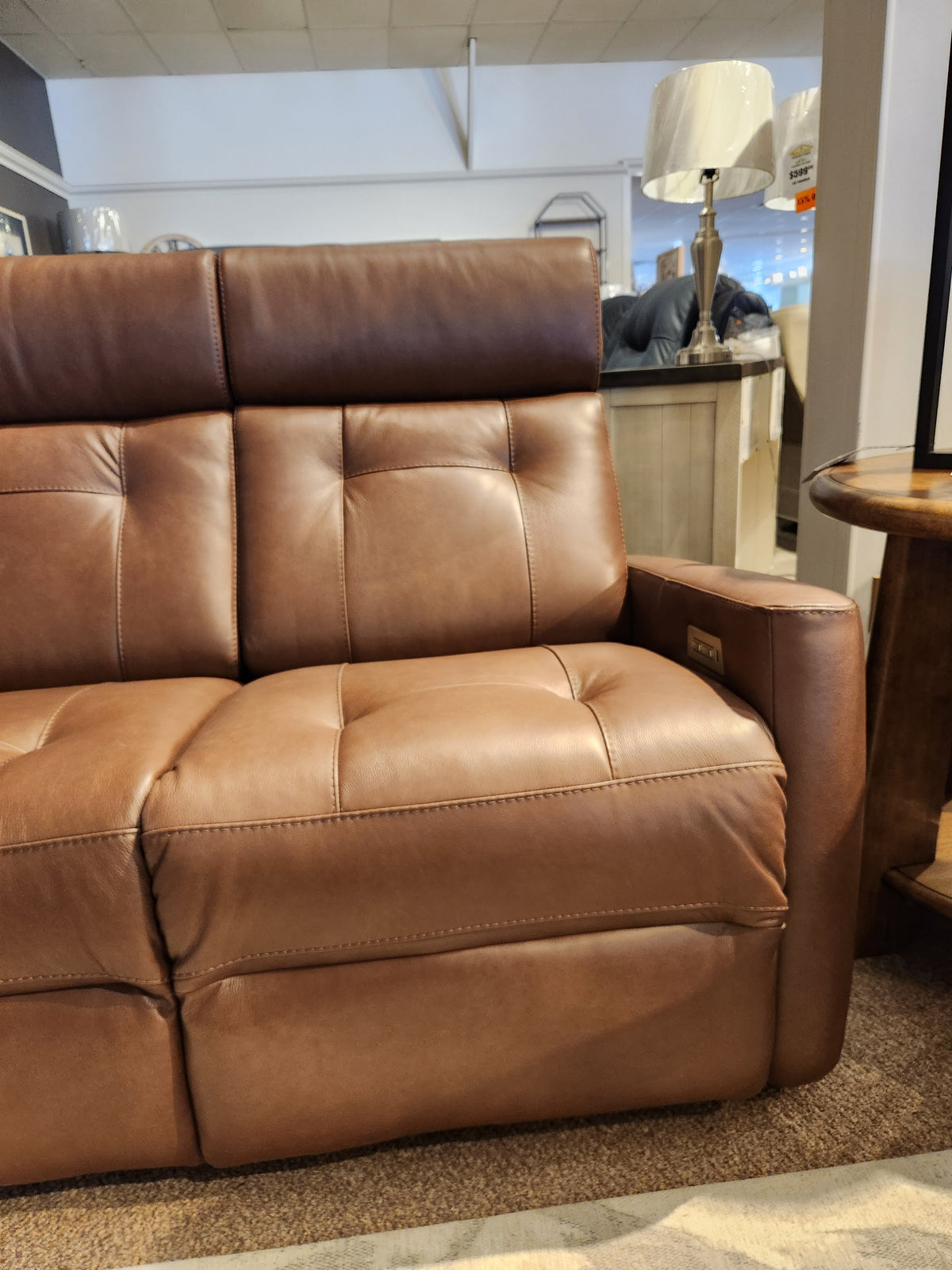 Palliser 42204 West Coast Power Reclining Sofa with headrest in real Canadian leather, on display.