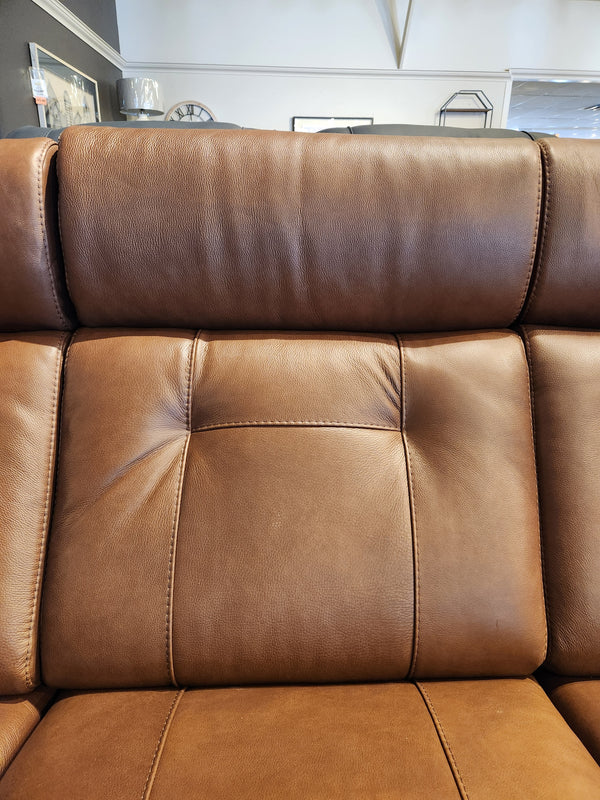 Close-up of the Palliser 42204 West Coast Power Reclining Sofa's leather backrest with stitching and tufted buttons.