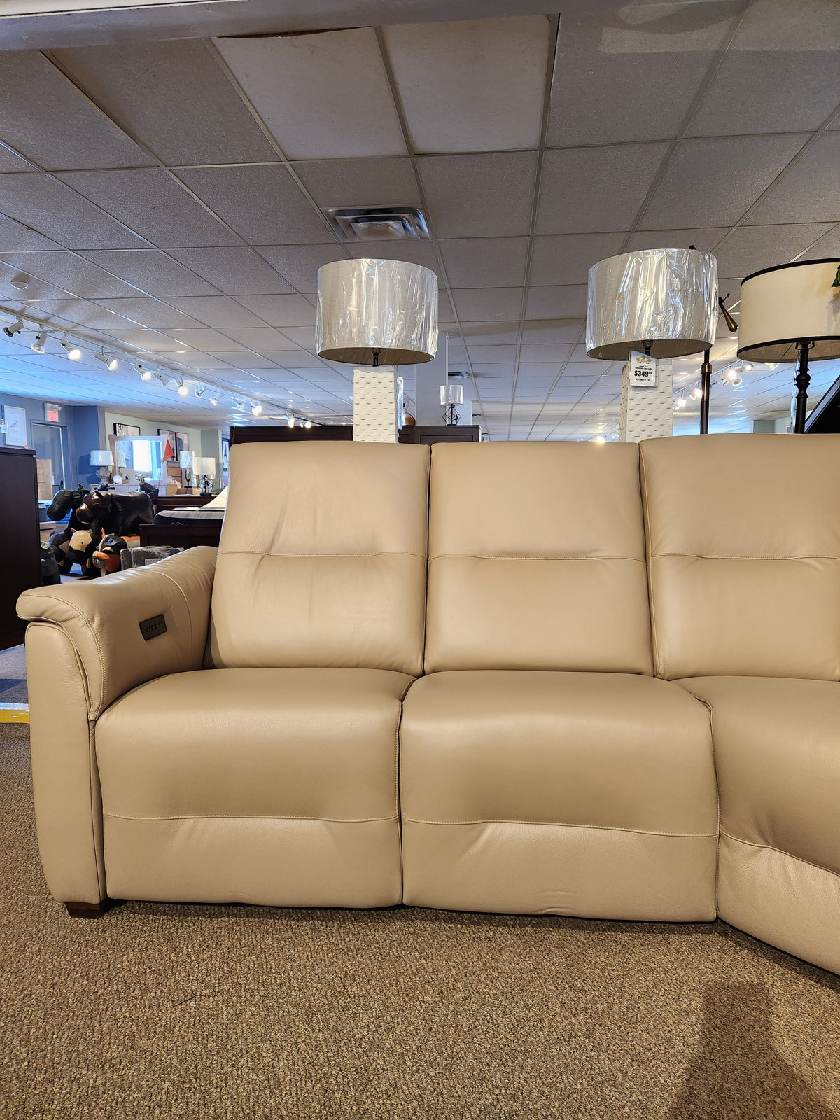 Palliser Oxford 3-piece sectional with power recline and adjustable headrest on display in the showroom.