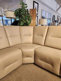 Palliser Oxford 3-piece sectional in beige leather with power recline and adjustable headrest, shown in showroom.