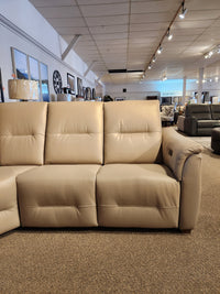 The Palliser Oxford 3-piece Sectional with power recline and adjustable headrest is shown on a carpeted showroom floor.