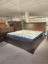 The Vokes 260 King Rustique Sleigh Bed in wormy maple, perfect for traditional bedrooms with matching dressers.