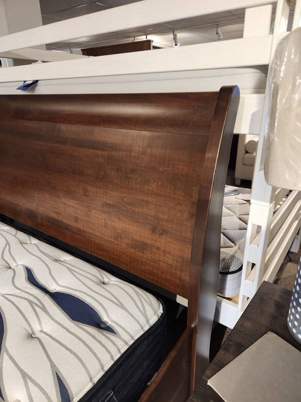 Close-up of Vokes 260 King Rustique Sleigh Bed headboard in wormy maple—ideal for traditional bedrooms.