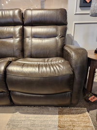 La-Z-Boy 807 Baron Reclining Loveseat in brown leather with visible stitching and lumbar support, shown in showroom.