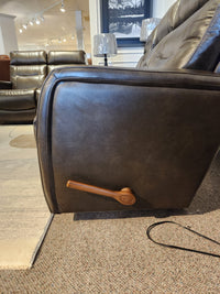 Side view of the La-Z-Boy 807 Baron Reclining Sofa with lumbar support and wooden lever handle in a showroom.