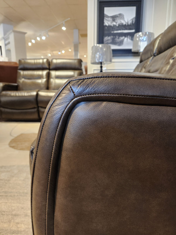 Close-up of the La-Z-Boy 807 Baron Reclining Sofa, with more sofas and decor in the showroom background.