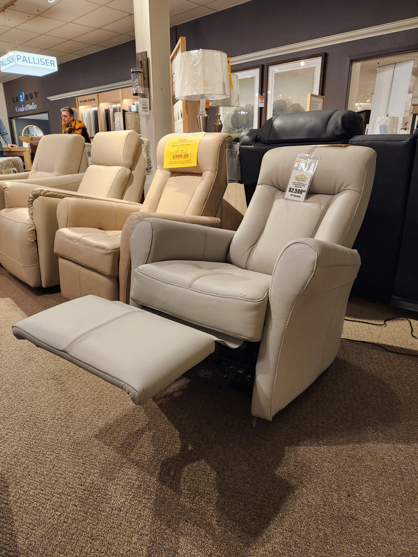 Palliser 42211 Yellowstone I Power Wall-Hugger recliner in light gray leather showcased in a furniture showroom.