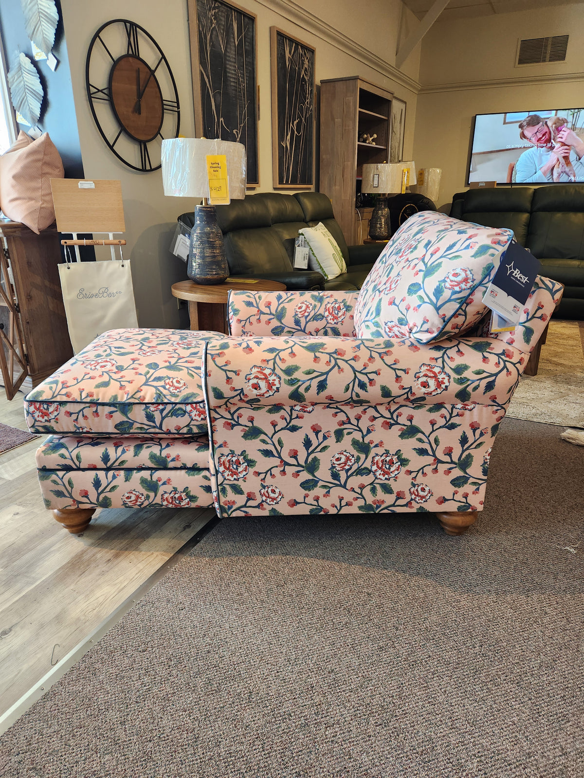 The Kress Chaise Lounge by Best features floral upholstery and wooden legs, bringing heirloom charm to your showroom.