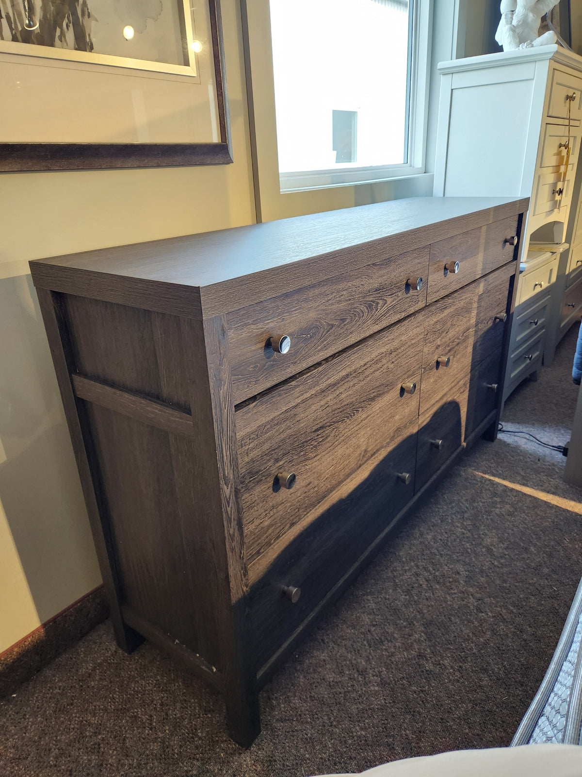 The Magnussen B6308 - Merrifield Dresser features six drawers with metal knobs, ideal for modern bedrooms.