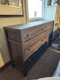 The Magnussen B6308 - Merrifield Dresser features six drawers with metal knobs, ideal for modern bedrooms.