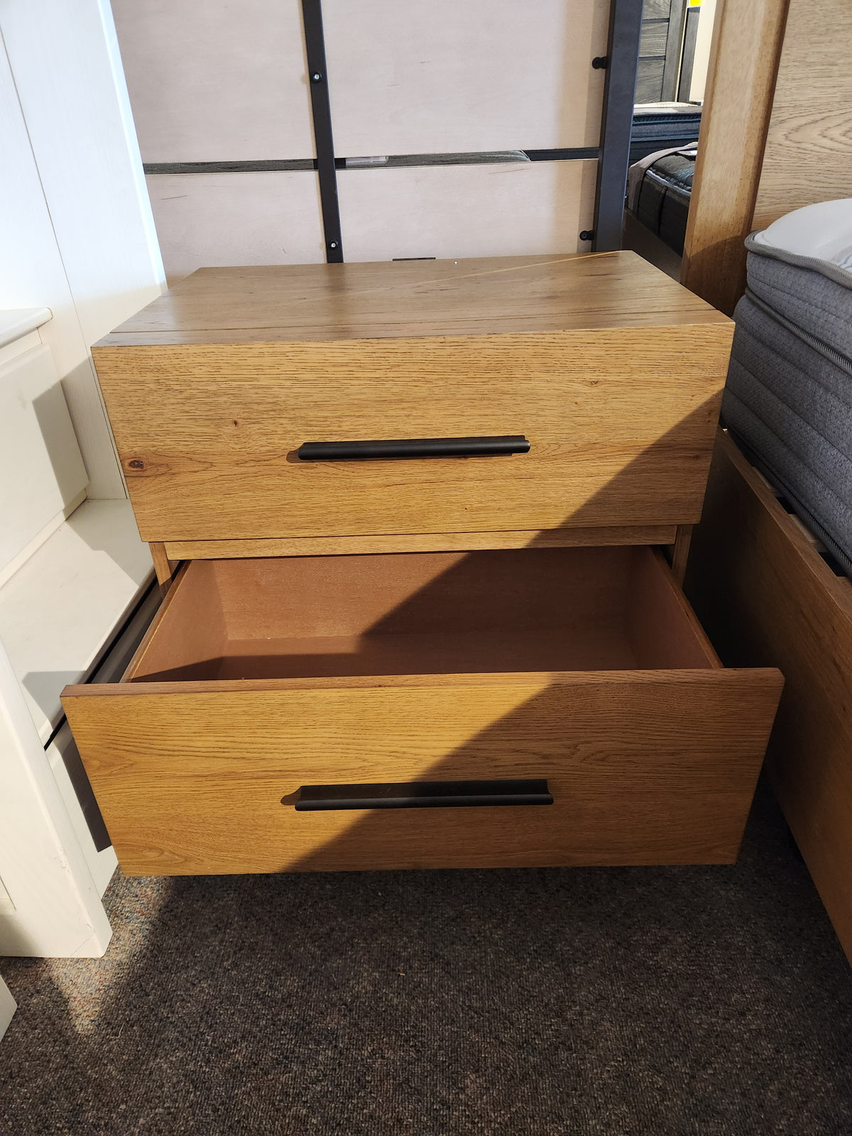 Magnussen B6309 Davenport Nightstand with 2 drawers in rustic caramel; bottom drawer open, top closed.