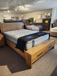 The Magnussen B6309 Davenport Queen Storage Bed in Rustic Caramel features storage drawers, ideal for modern bedrooms.