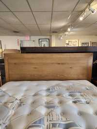 The Magnussen B6309 Davenport Queen Storage Bed is featured in a mid-century modern bedroom.